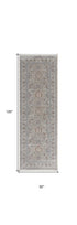 7' X 10' Silver Taupe and Blue Oriental Power Loom Worn Faded Area Rug With Fringe